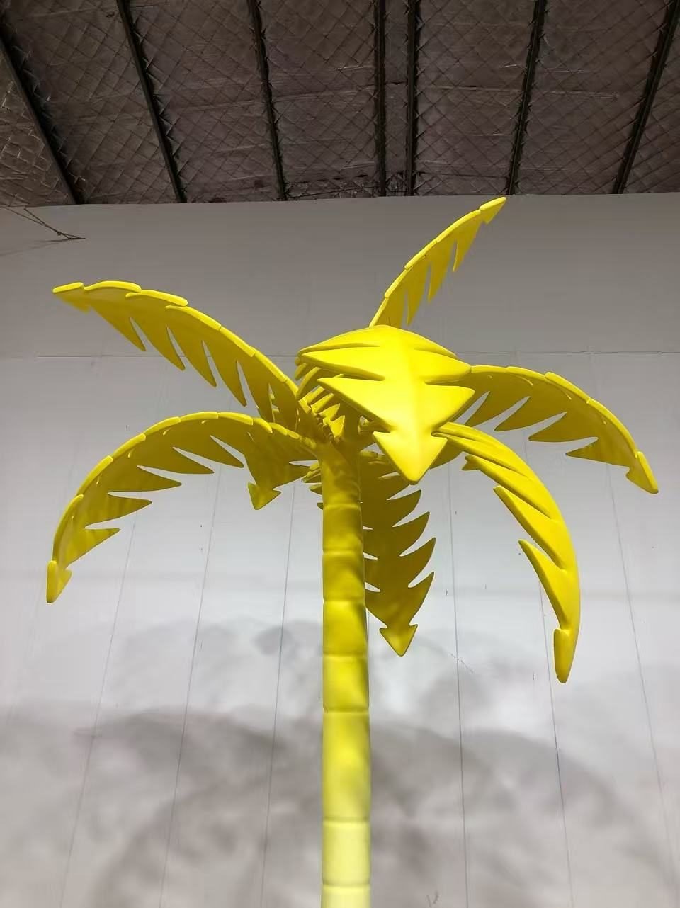 Close view of layered yellow palm leaves