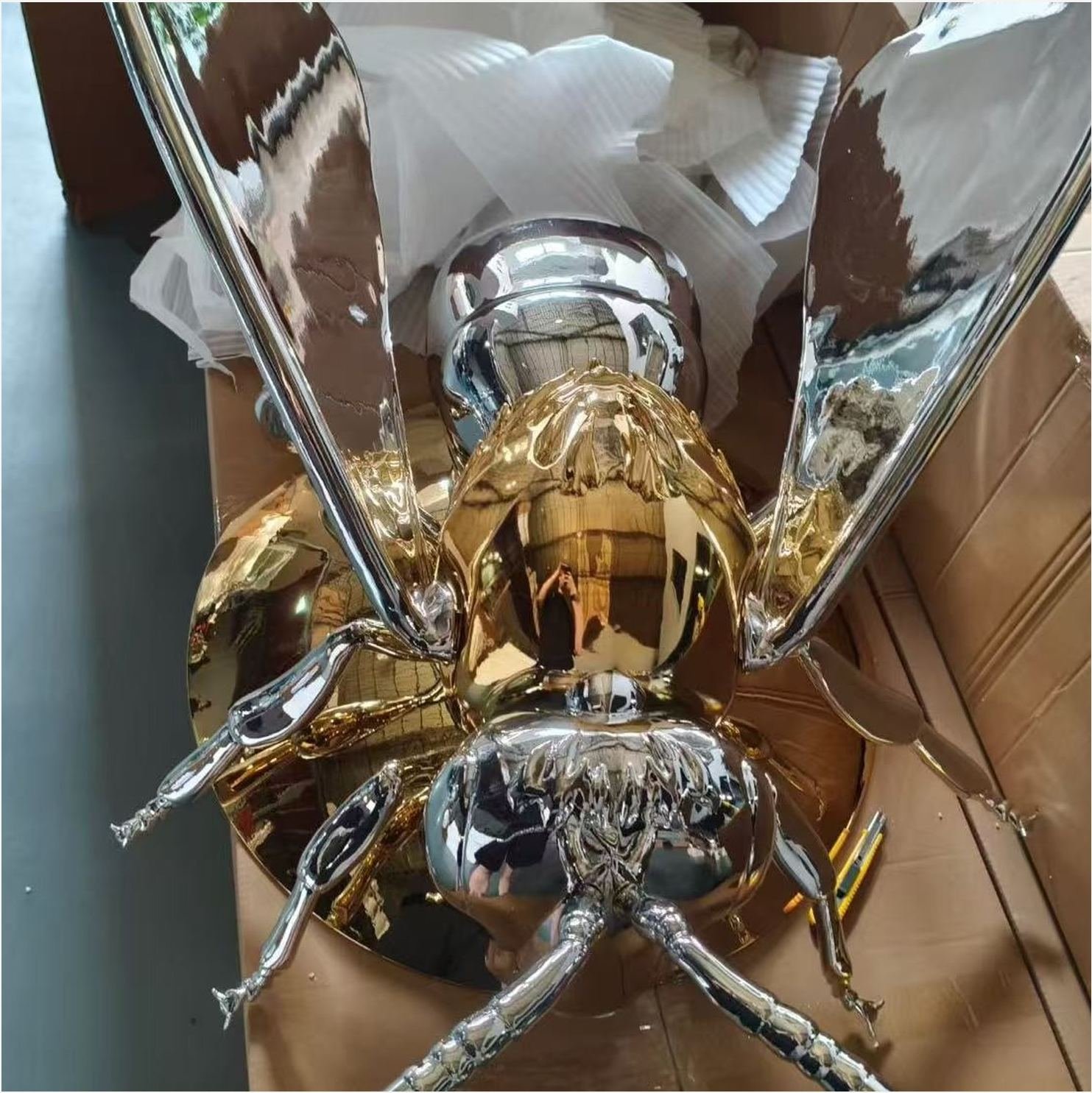 Chrome and gold winged insect display sculpture