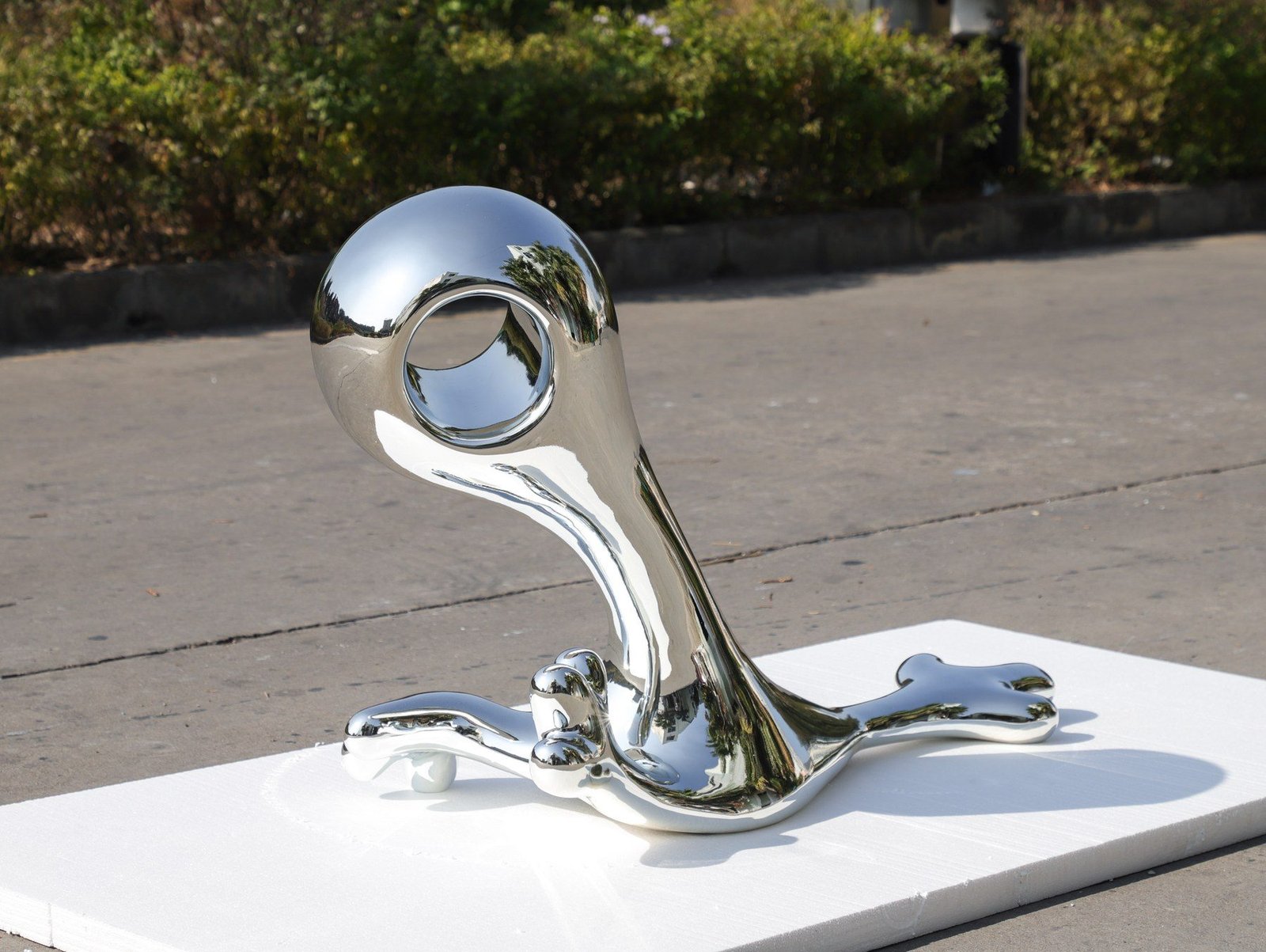 Angled front view of the circular chrome-finish display form