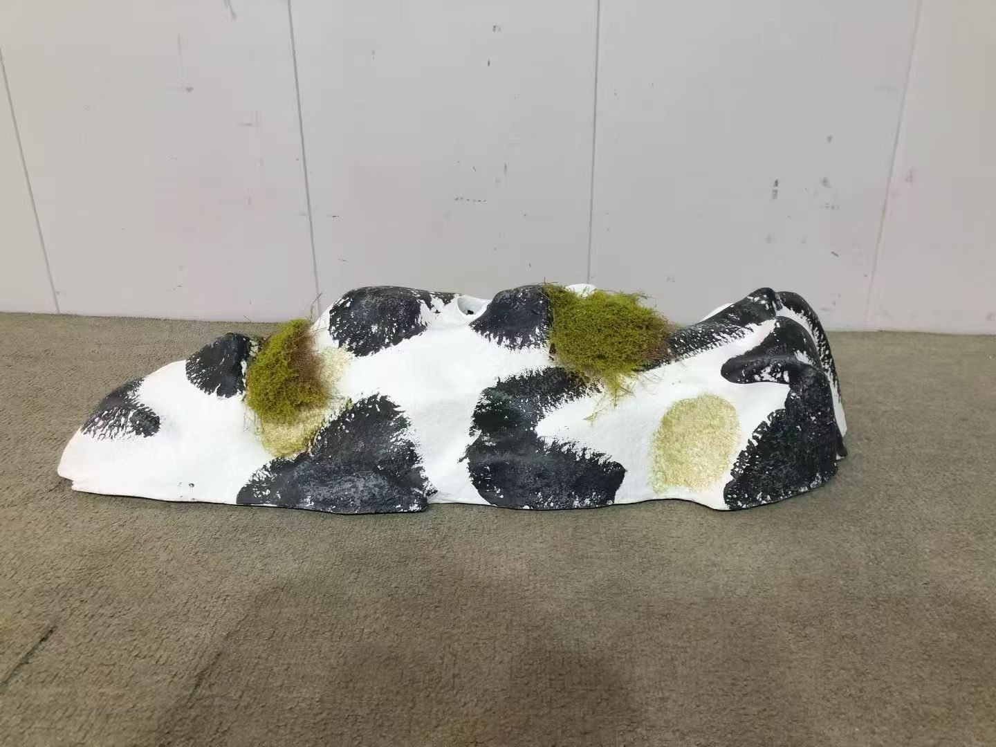 Individual faux rock module with green moss accents