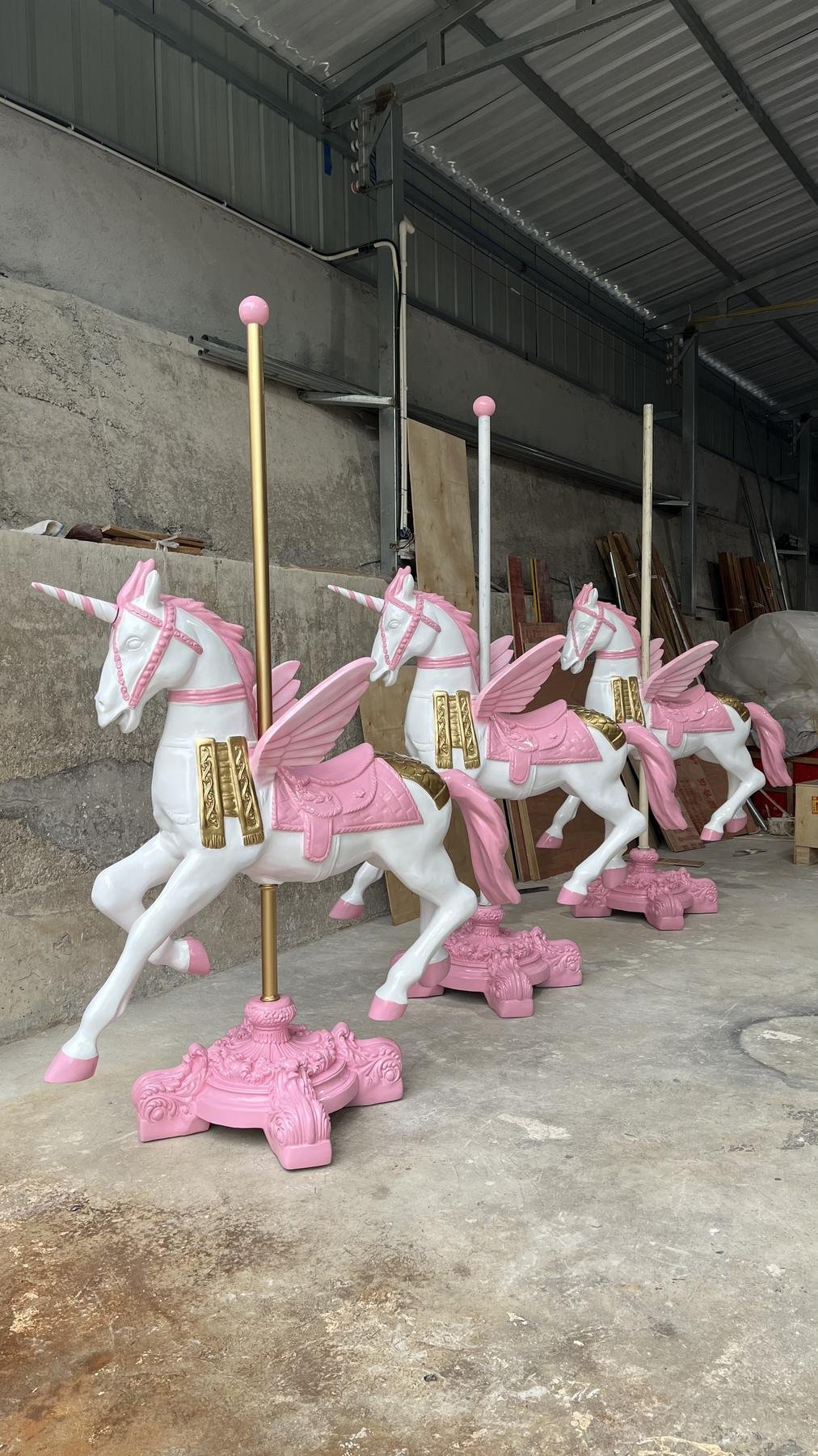 Completed winged horse display sculptures on decorative bases