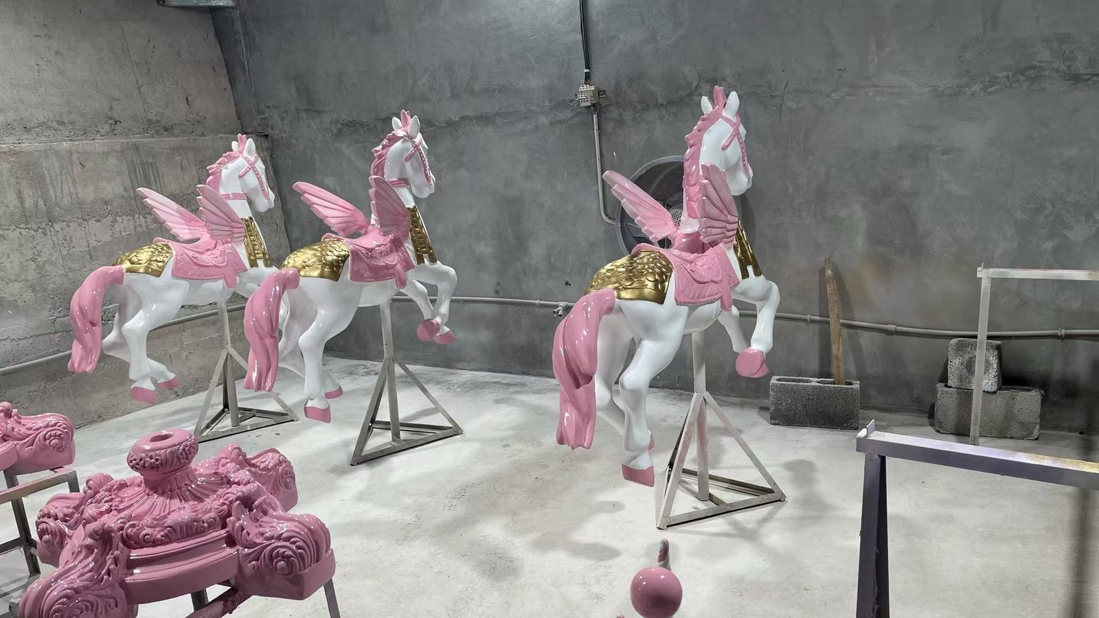 Winged horse display props during workshop assembly