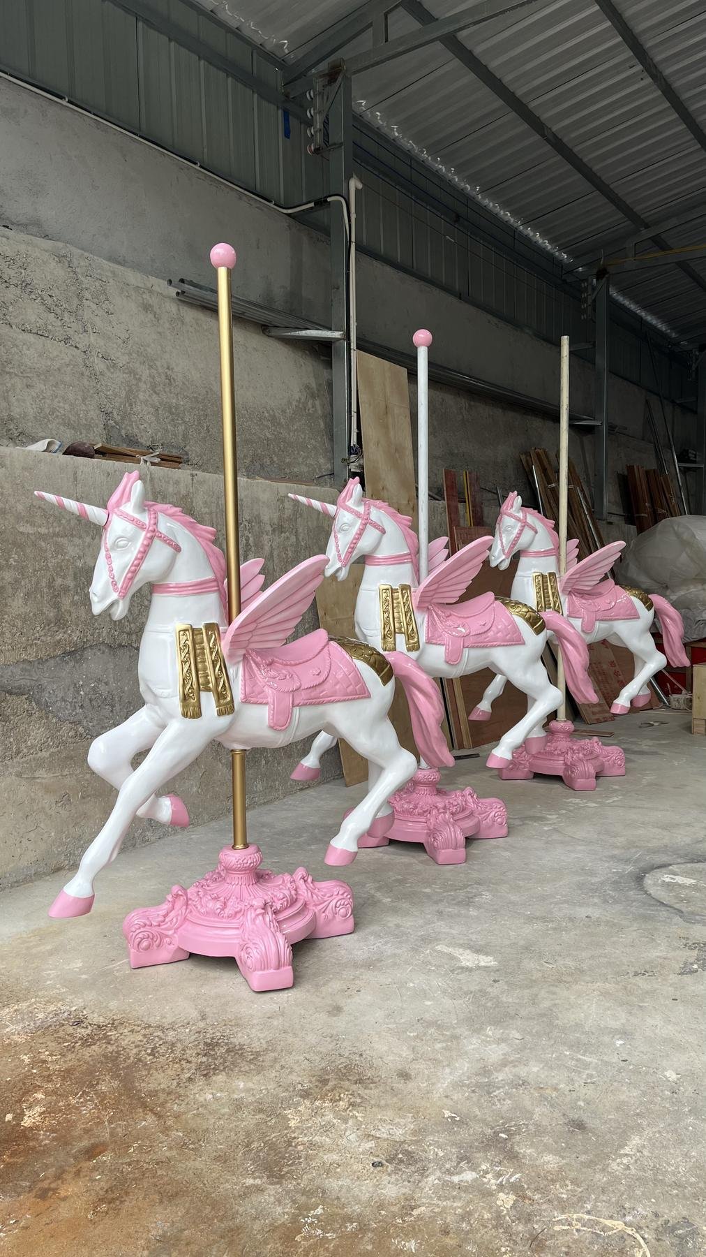 Batch of white and pink Pegasus display sculptures