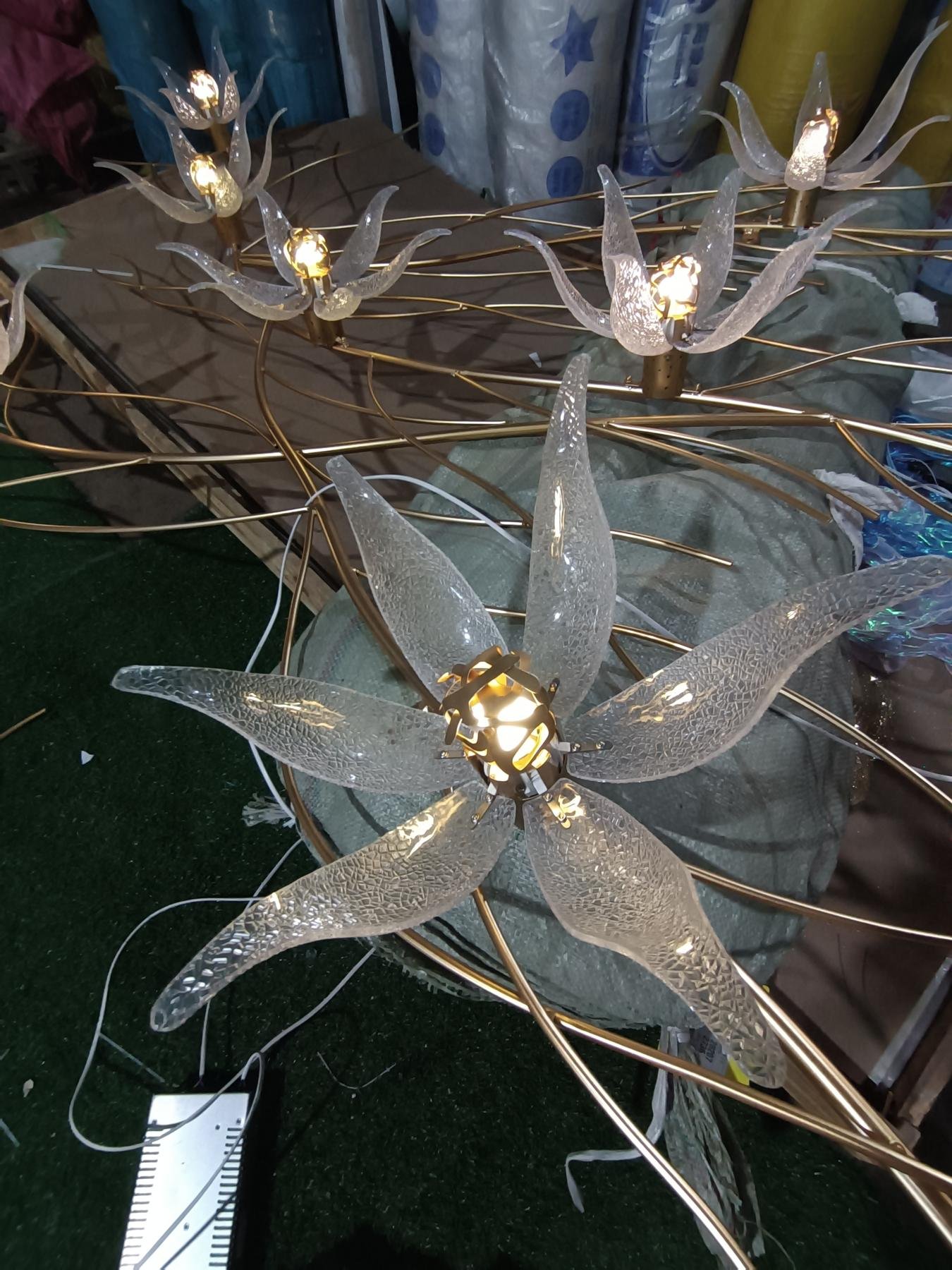 Close view of clear acrylic petals around an illuminated center