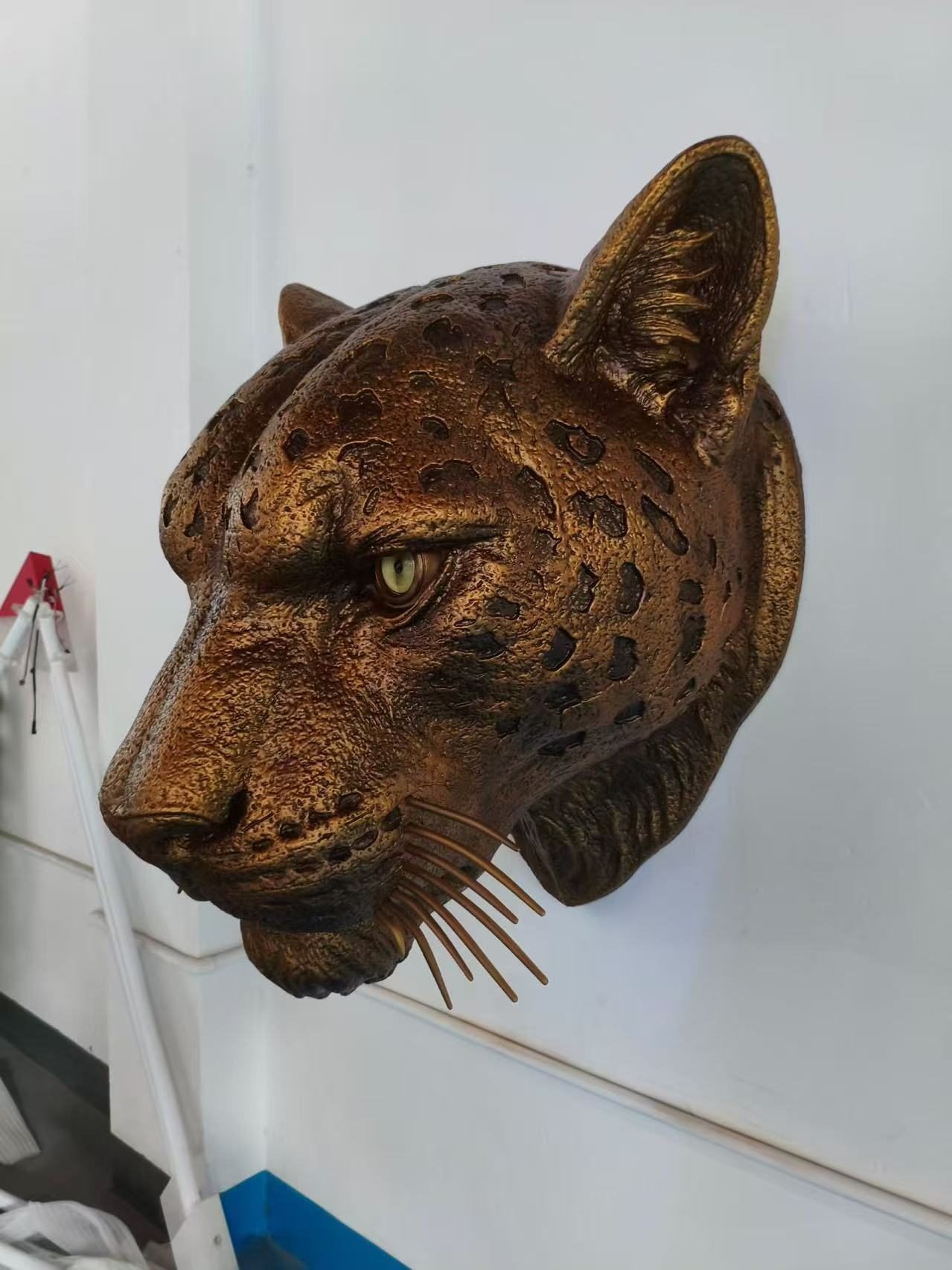 Angled view of the leopard head wall display